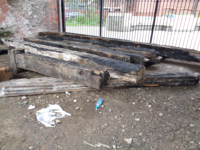 Burnt beams in a railway arch in Crown Street Car Park (taken Dec 2 2015).