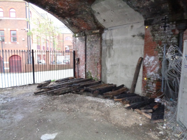 Burnt beams in a railway arch in Crown Street Car Park (taken Dec 2 2015).