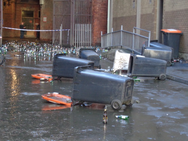 Bottles (presumably from the wheelie bins) in the mud on Little Neville Street (taken Dec 27 2015).