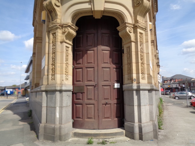 The nice wood door on the old Midland Bank at the junction of Meanwood Road and North Street, Leeds (taken May 5 2016).